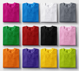 folded colorful t-shirts on white background.