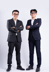 Wall Mural - Two Asian businessman posing on white background