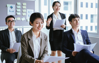 Portrait of Asian businesswoman presenting her plan in a meeting