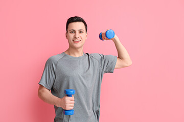 Sticker - Sporty male coach with dumbbells on color background