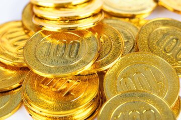 Golden dazzling gold coins represent wealth