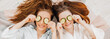 © Daria Lukoiko - Two girls make homemade face and hair beauty masks. Cucumbers for the freshness of the skin around the eyes. Women take care of youthful skin. Girlfriends laugh at home lying on the floor on pillows.