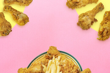 Background with fried chicken legs. Vintage template on the theme of fast food with an empty place for text or menu.