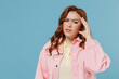 © ViDi Studio - Young sad confused puzzled redhead chubby overweight woman 30s wear pink shirt casual clothes looking camera prop up forehead head isolated on pastel blue background studio People lifestyle concep