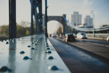 rivet as a detail of an old suspension bridge and city road in perspective