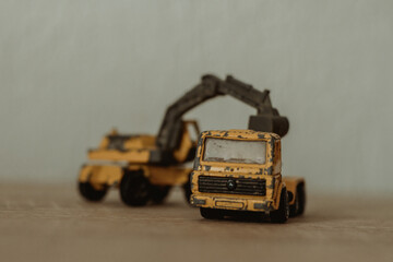 Poster - Closeup image of a black and yellow weathered construction machine