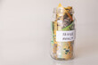 © Austockphoto - Copy space and jar of australian notes with travel money written on it