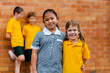 © Austockphoto - Happy school friends with different ethnicities smiling together happy to be back to school