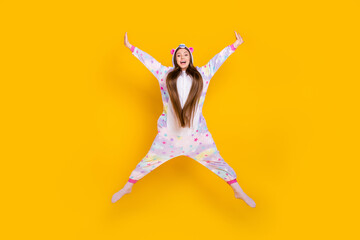 Wall Mural - Full length body size view of pretty cheerful carefree girl jumping having fun wear animal look isolated over bright yellow color background