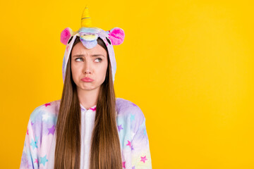 Sticker - Photo of unhappy upset young woman look empty space wear pajama isolated on yellow color background