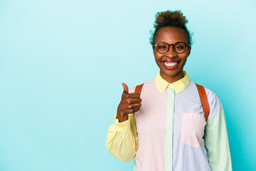 Young student african american woman over isolated background smiling and raising thumb up