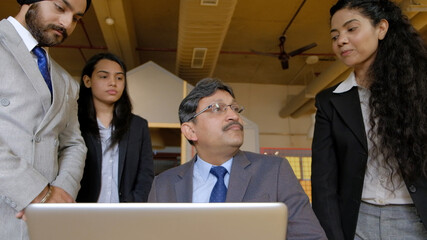 Poster - Group of Indian co-workers during a business meeting