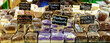 banner of many flavors of fudge wrapped in plastic with signs behind glass