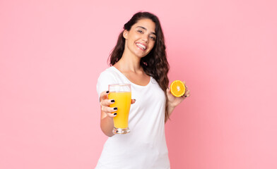 Wall Mural - pretty young woman. orange juice concept