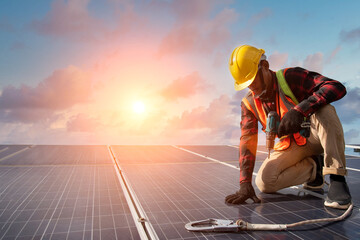 Wall Mural - solar cell a man working at solar power station installing a solar cell on a roof.