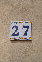 Decorated Ceramic Tiles 27 House Number On Cream Rough Wall