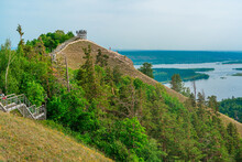 Panorama Of Mountains With A Dense Forest And The Volga River On The Background, Photographed From A Height. Nature Of Russia