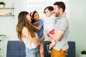 Cute little boy telling his family how much he loves them