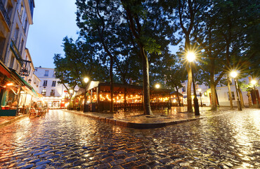 Poster - The Montmartre street at rainy evening , Paris, France