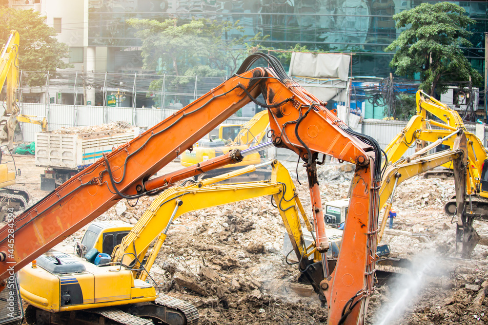 Demolition crane dismantling a building. jackhammer, Excavator, cutter ...