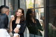 © Me studio - Group of Business People Enjoying Coffee while Standing in Urban at Breaking time.