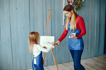 Mom and daughter are drawing