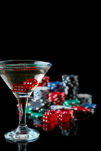 Stack Of Casino Gambling Chips, Glass Of Martini Vermouth And Red Dices Isolated On Reflective Black Background