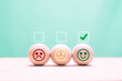 check mark on happy smiley face in wooden circle for feedback rating and positive customer review and world mental health day