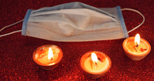 Candles For Diwali Festival And A Face Mask On A Red Background