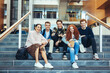 © Jacob Lund - College students sitting on steps after class