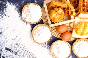 sprinkling white flour over dough on kitchen background, Baking Cooking Ingredients Flour Eggs and Butter 
