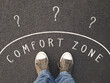 feet of unrecognizable person standing inside comfort zone