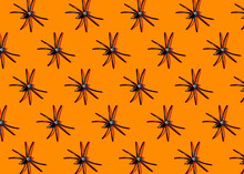 Pattern Of Black Spiders Against Orange Background