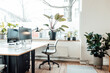 © Gustafsson/Westend61 - Plants by window and desk in office