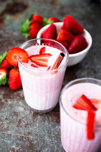 Fresh Strawberries And Two Glasses Of Strawberry Smoothie