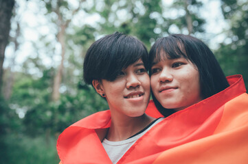 Wall Mural - Couple of girl with girl,LGBT Pride month concept,Asian Handsome male make up and wear woman cloth,Gay Freedom Day,Portrait of Non-binary on white background