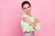 © deagreez - Photo of charming happy nice young woman hug herself smile good mood isolated on pink color background