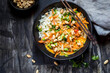 © Susan Brooks-Dammann/Westend61 - Peanuts garnished with yellow cauliflower and rice thai curry on table