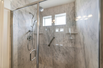 Wall Mural - Shower tub in a bathroom with tile walls