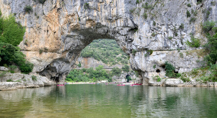 Wall Mural - river in tthe gorges of the Ardèche in France with canoe under a arch in  the cliff