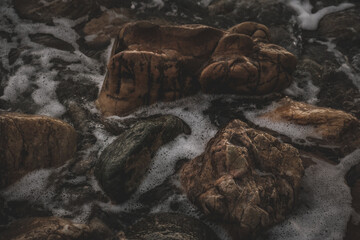 Closeup shot of a rocky shore for wallpaper and background