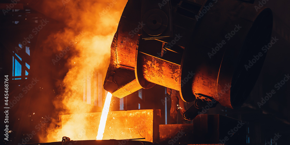 Molten metal pouring from big ladle. Iron cast process.Metallurgical plant. Steel mill factory. - obrazy, fototapety, plakaty 