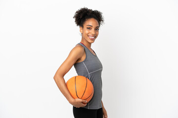 Young basketball player latin woman isolated on white background playing basketball