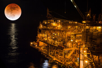 Wall Mural - Offshore the night Industry oil and gas background super blue blood moon