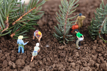 Wall Mural - Dolls who are busy planting trees during Arbor Day