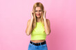 © luismolinero - Young Uruguayan blonde woman over isolated pink background frustrated and covering ears