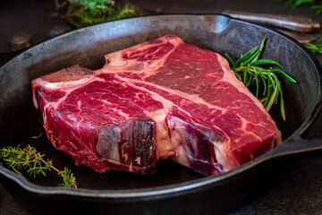 Wall Mural - Porterhouse steak in a cast iron pan