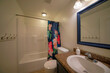 Interior of a windowless bathroom with brown and blue tones
