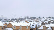 Pano Big and beautiful houses with white roofs with the white cloudy sky