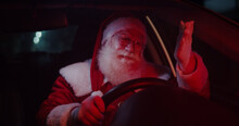 Santa Claus Annoyed In Car Stuck In Traffic.